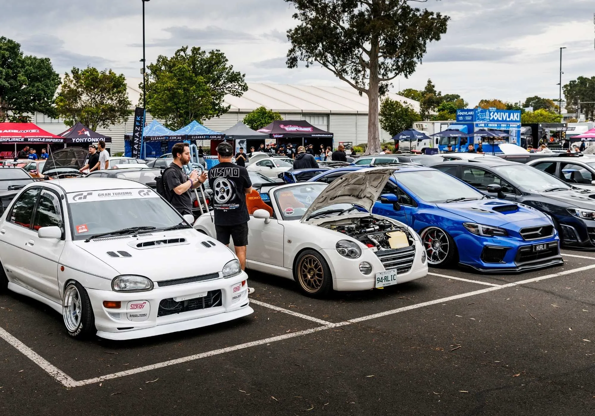 A row of Japanese hatches and sedans parked up at All Japan World