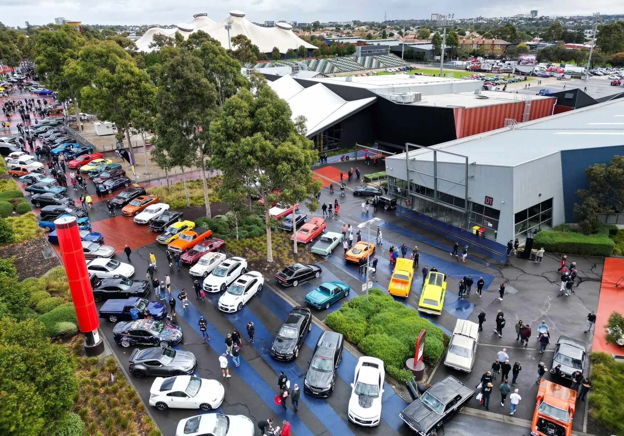 Show cars lined up across Melbourne Showgrounds from above