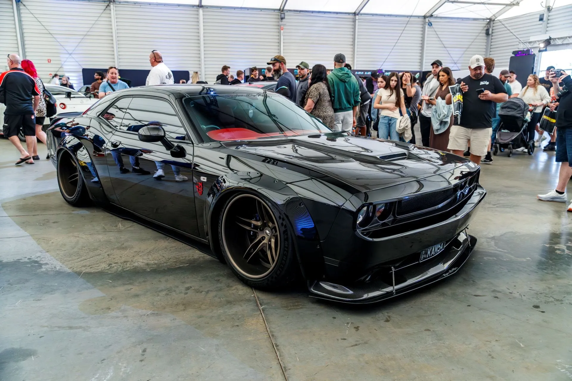 A widebody black muscle car in Portelli World