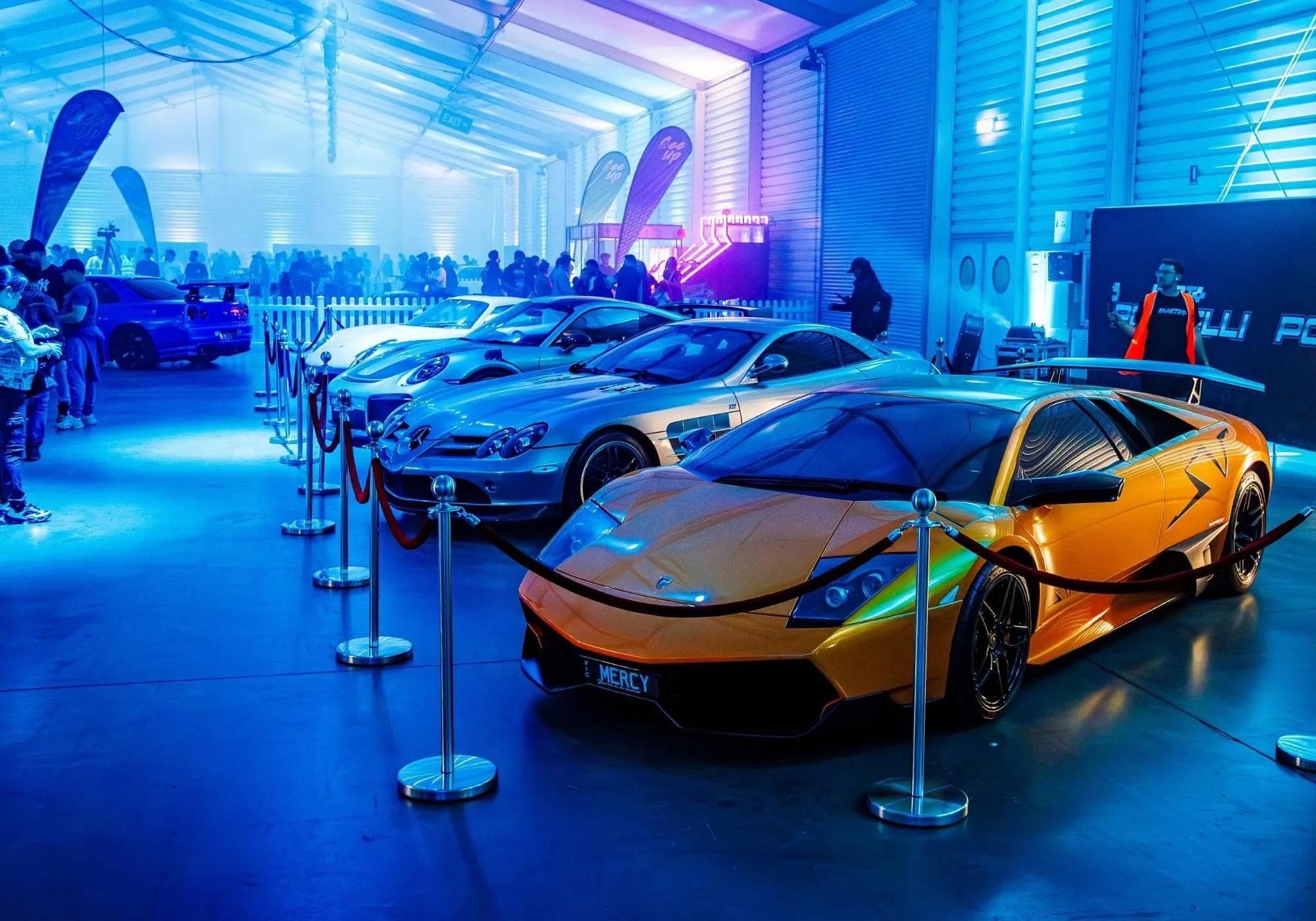 Hypercars lit in blue inside LMCT+ Portelli World