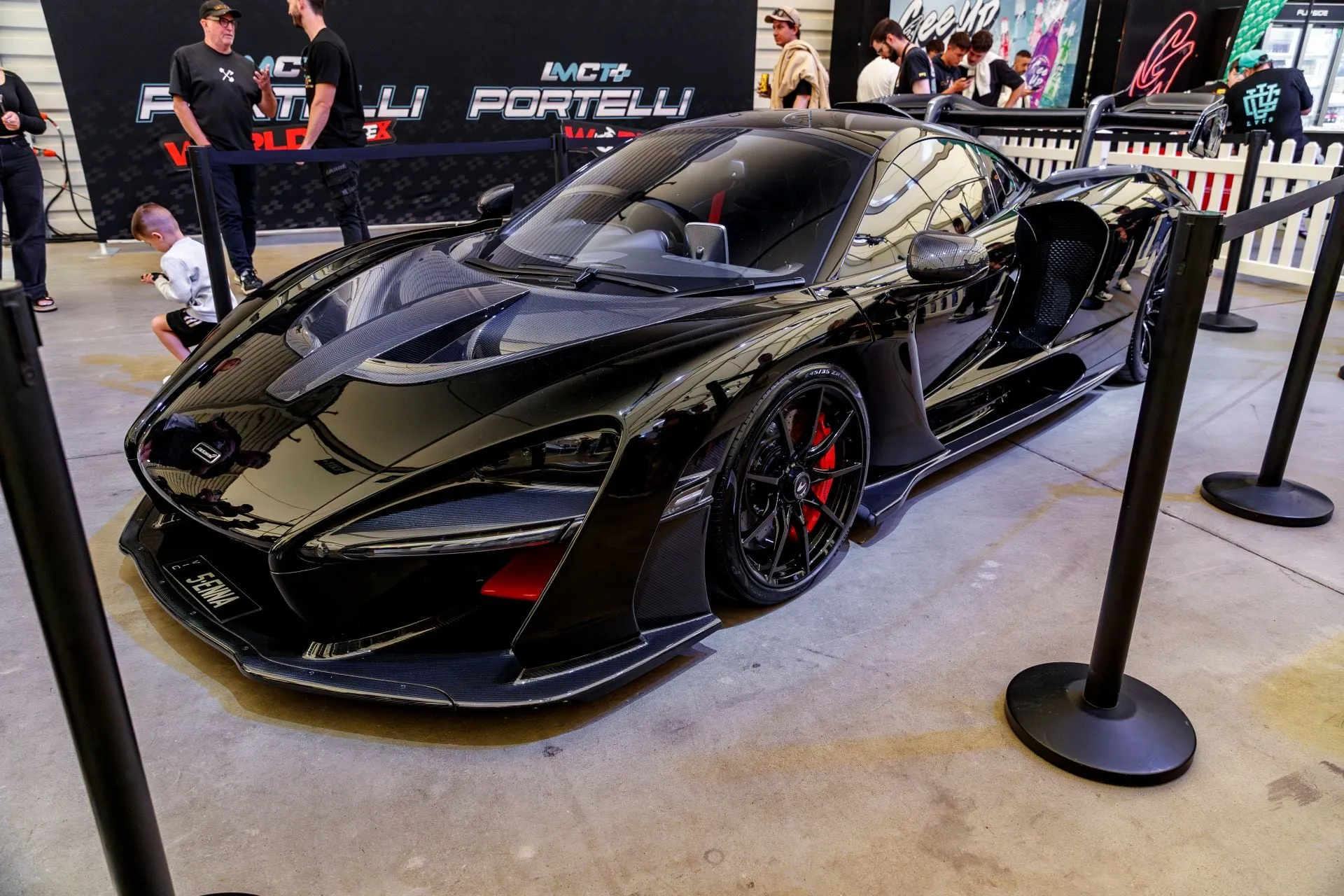 A black McLaren hypercar on display in Portelli World