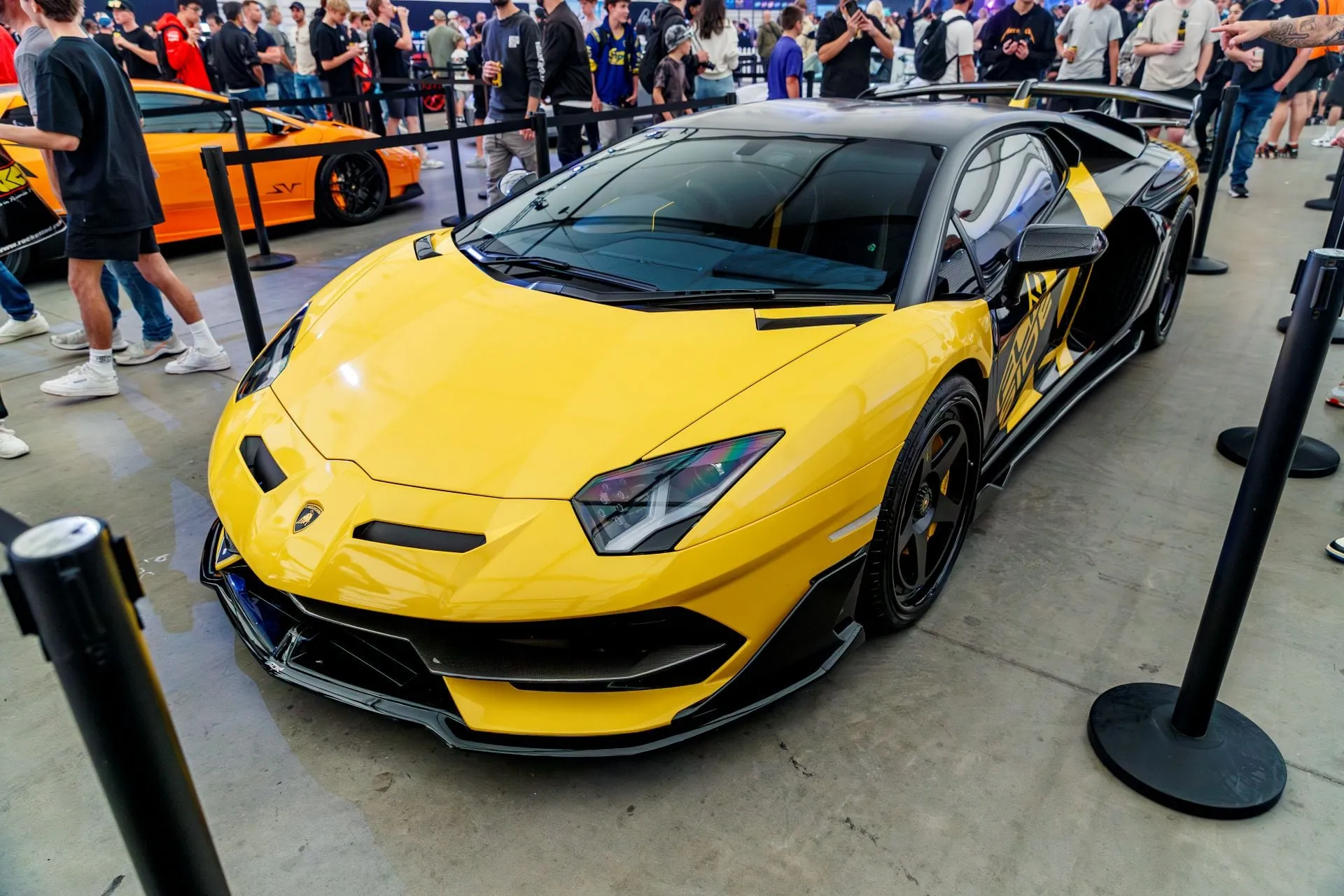 A yellow Lamborghini on display in Portelli World
