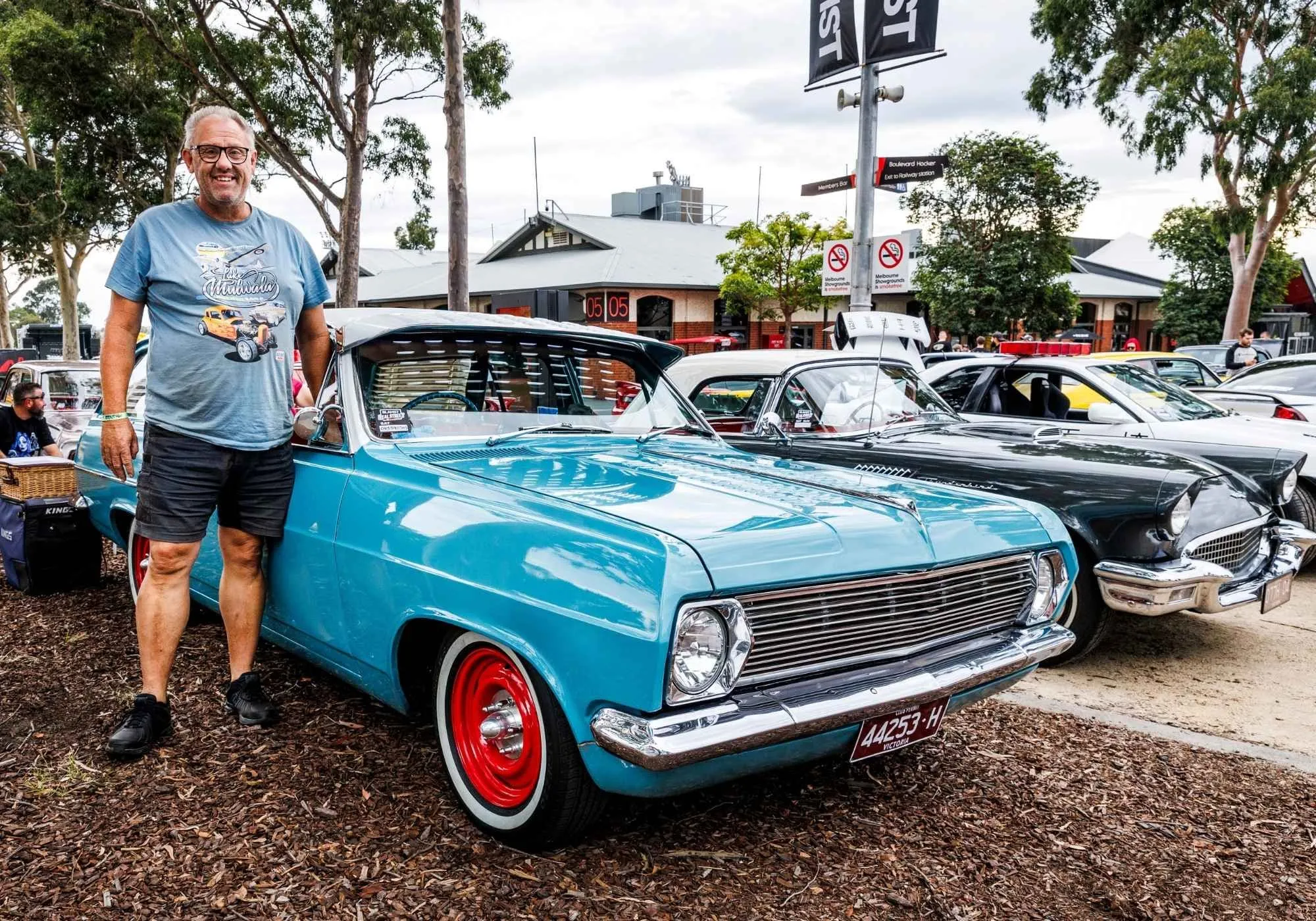 A blue HT Holden on the grass in BLAHST Real Street